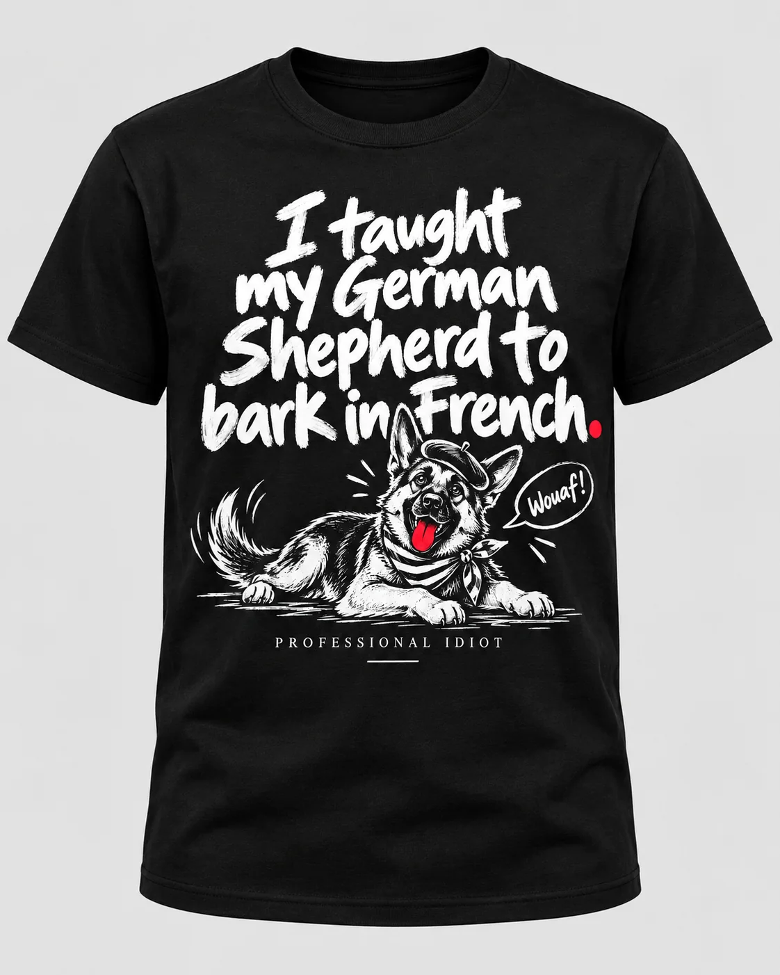 Black t-shirt with white hand-lettered saying 'I taught my German Shepherd to bark in French.' above an illustrated German Shepherd in a beret and striped neckerchief saying 'Wouaf!'
